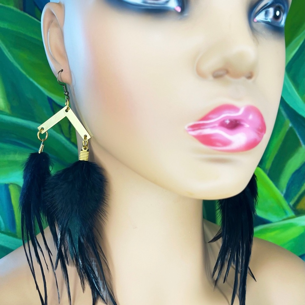 Long black feather earrings with gold arrow pendants